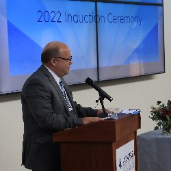 Superintendent Tom Gregory delivers speech during the 2022 Hall of Excellence